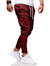 Men jogger pants in Burgundy with multiple pockets and drawstring waist for comfortable leisure wear